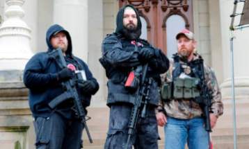 Armed Protesters byJeff Kowalsky/AFP via Getty Images from The Guardian